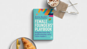 Female founders playboy next to a coffee and croissant