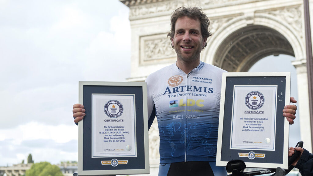 Mark Beaumont poses with his Guinness World Records