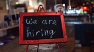 We are hiring sign on a restaurant table