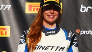 Female racing driver in a Ginetta top