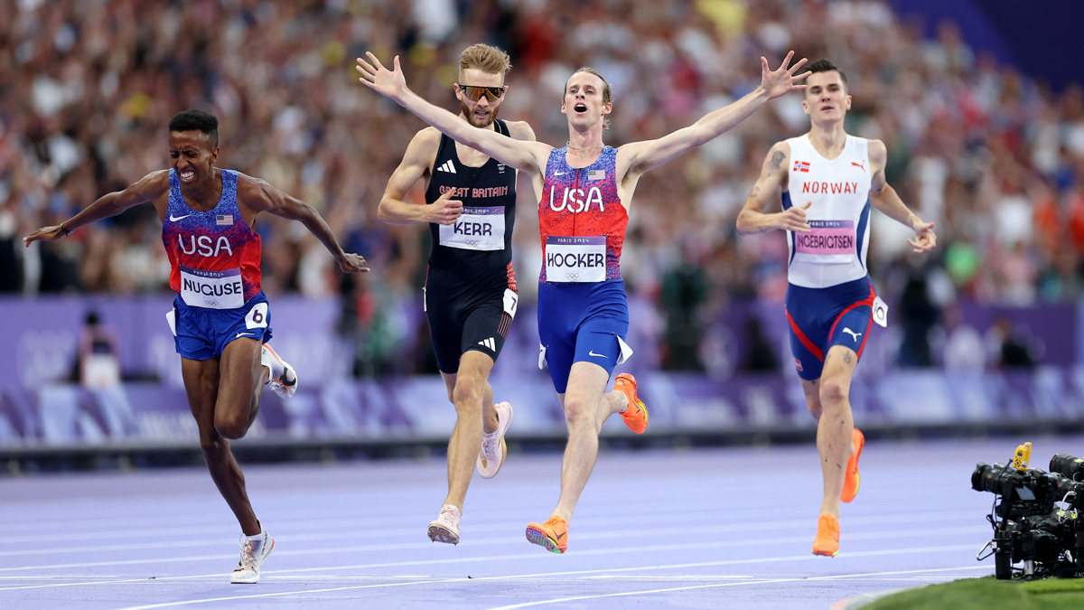 Cole Hocker crosses the finish line of the Men's 1500m final ahead of bronze medallist Yared Nuguse, silver medallist Josh Kerr and Jakob Ingebrigtsen