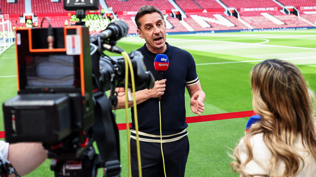 Gary Neville reporting for Sky Sports pitch side at Old Trafford ahead of the Premier League match between Manchester United and Arsenal