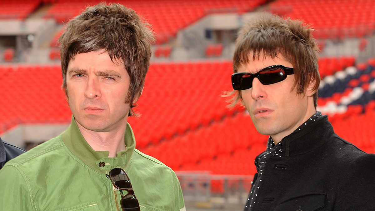 Noel Gallagher and Liam Gallagher of Oasis pose at Wembley Stadium