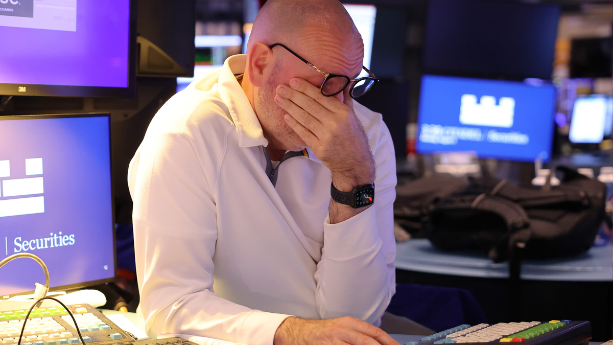 Trader at work on the floor of the New York Stock Exchange