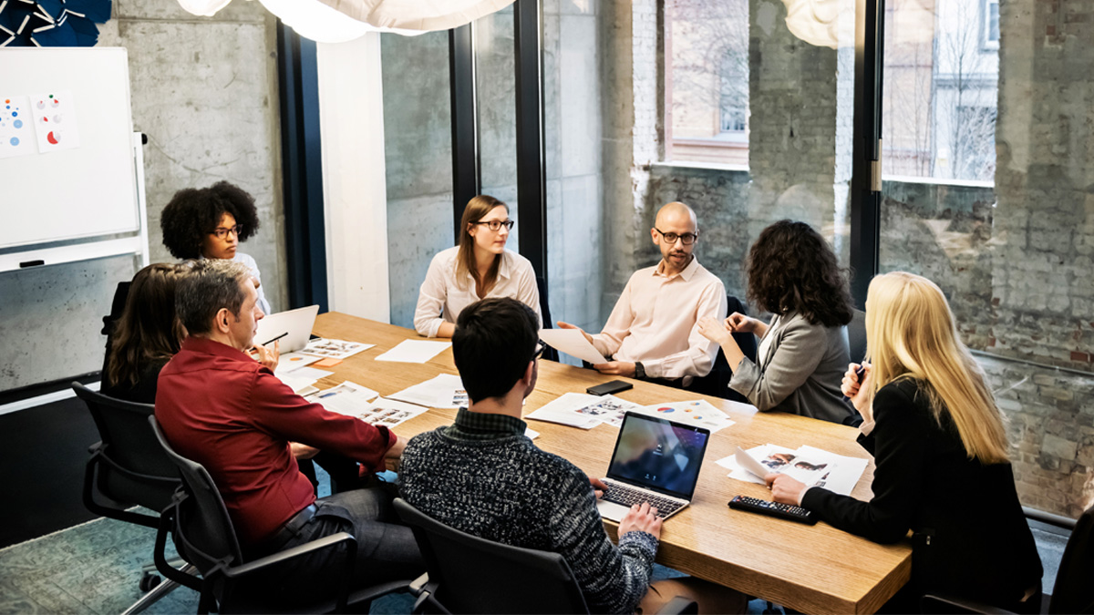 A group of young people in a business meeting