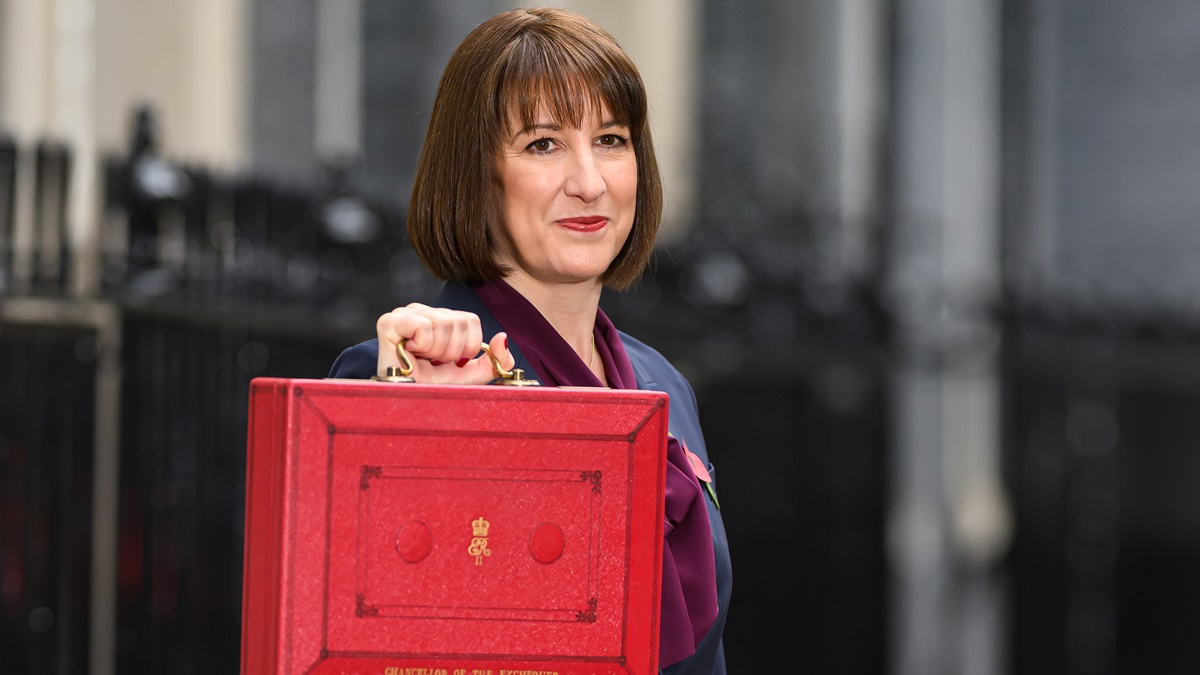 LONDON, ENGLAND - OCTOBER 30: Chancellor of the Exchequer, Rachel Reeves, poses with the red Budget Box as she leaves 11 Downing Street to present the government's annual budget to Parliament on October 30, 2024 in London, England. This is the first Budget presented by the new Labour government and Chancellor of the Exchequer, Rachel Reeves. (Photo by Leon Neal/Getty Images)