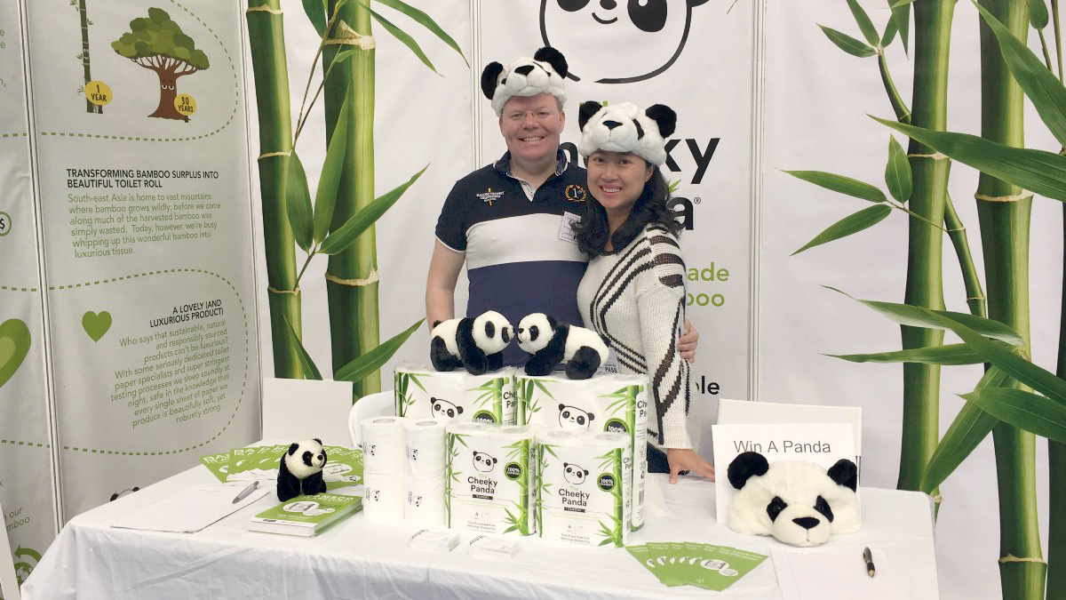 Cheeky Panda co-founder Julie Chen and her husband proudly wear their hats at a trade show