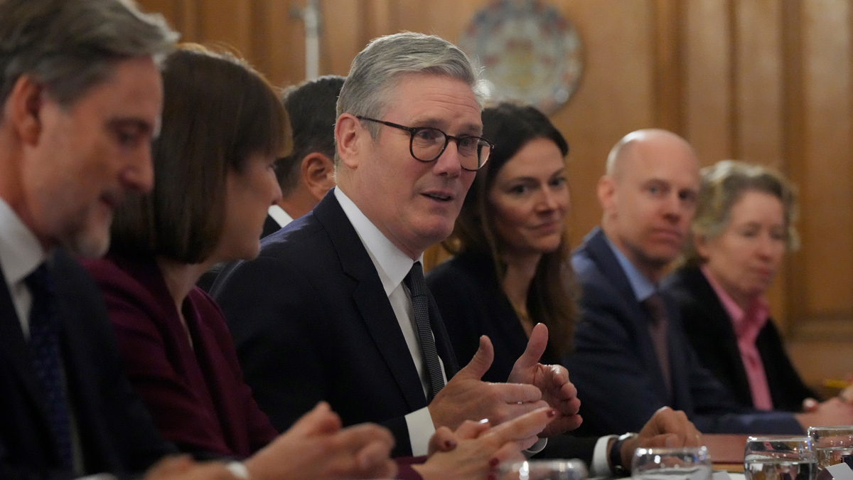 Britain's Prime Minister Keir Starmer (C), and Chancellor of the Exchequer Rachel Reeves (2L), host an investment roundtable discussion with members of the BlackRock executive board at 10 Downing Street