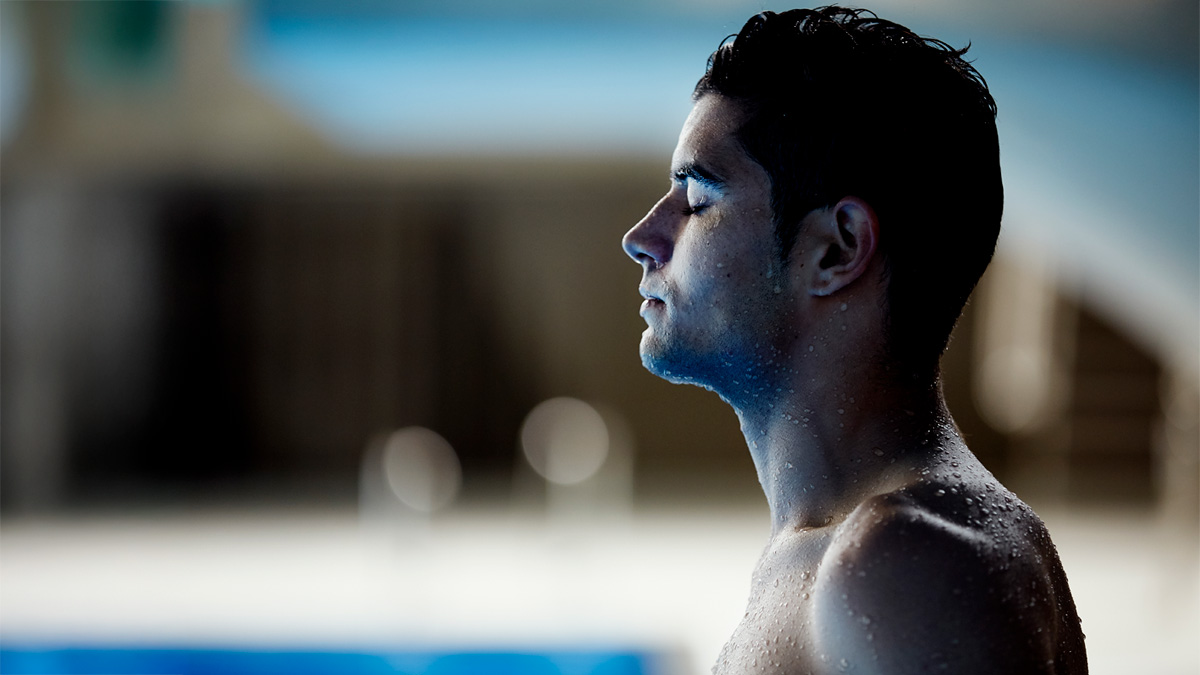 Male swimmer with eyes closed