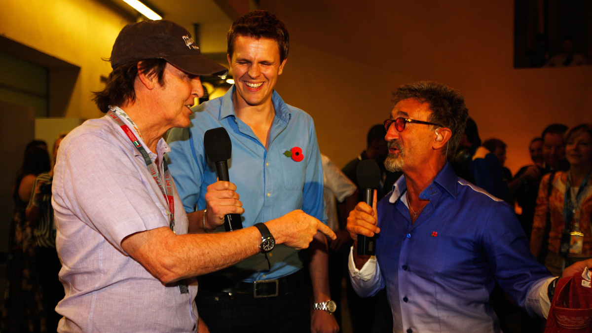 Musician Paul McCartney talks with Jake Humphrey and Eddie Jordan in the paddock following qualifying for the 2011 Abu Dhabi Formula One Grand Prix