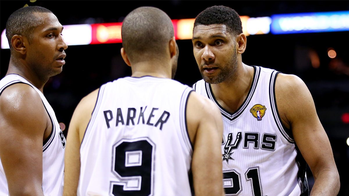 Tim Duncan speaks to Tony Parker during the 2014 NBA Finals, which the San Antonio Spurs won